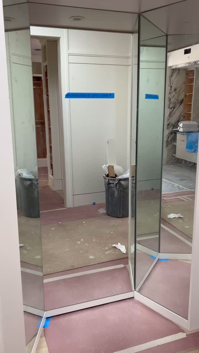 Hidden mirror entryway into the master shoe closet.