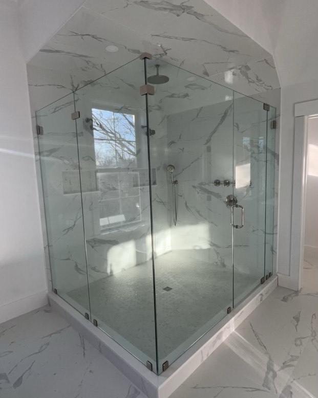 Luiz and Andrew with a nice install today. 5 panel frameless enclosure. #glassdoor #shower #framelessglass