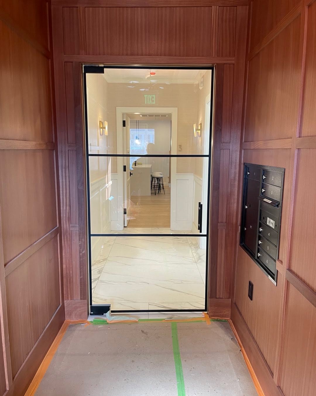 Interior grid entryway into this new home. Patch lock fittings making this door a slow hydraulic close. #glassdoor #entryway #grid