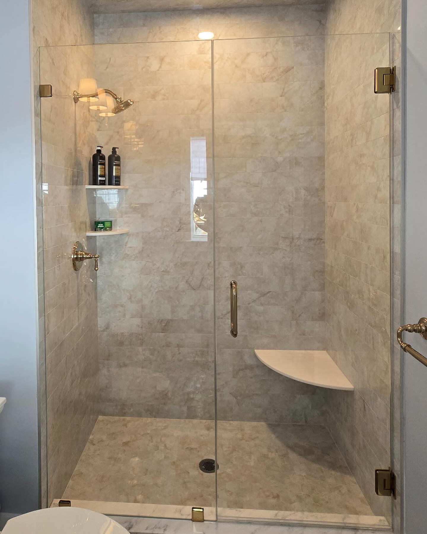 Ted put in a couple inline showers in today working some extra hours, using some oversized French Gold hardware from @crlaurence and glass from @qualityenclosuresinc