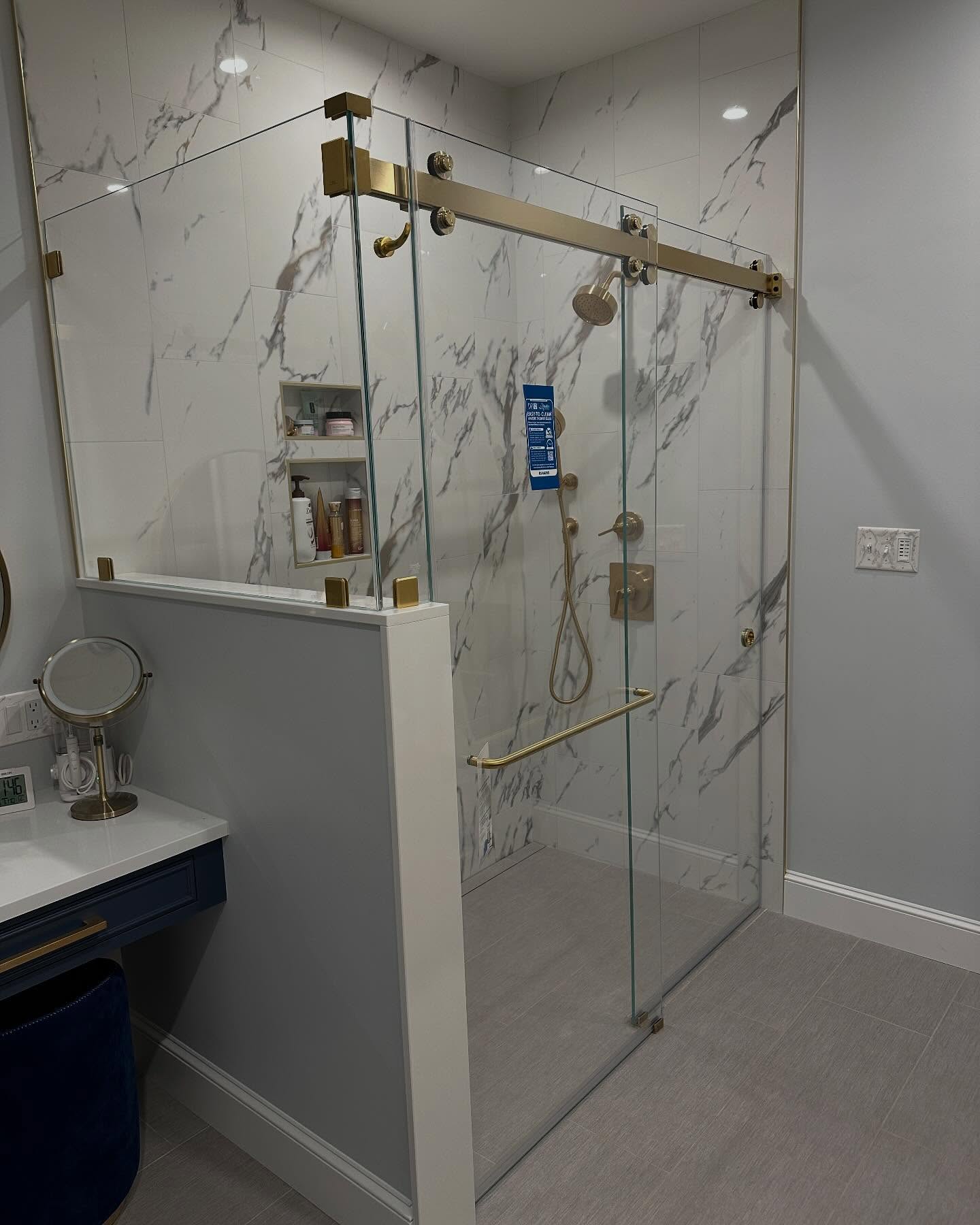 Kev and Corey just finished up this install today using @crlaurence satin brass hardware, lowiron glass from @qualityenclosuresinc and @diamonfusionintl protective coating to keep it looking this good for a long time.