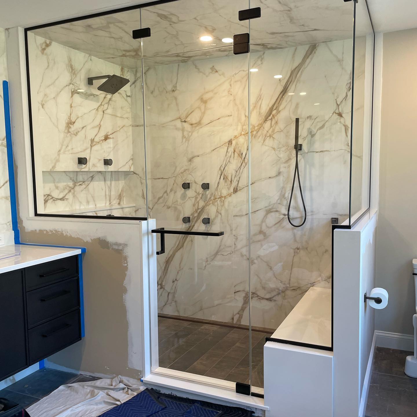 Finishing off the week with this clean looking steam shower using low iron glass and matte black hardware. #steam #framelessglass #showerenclosure
