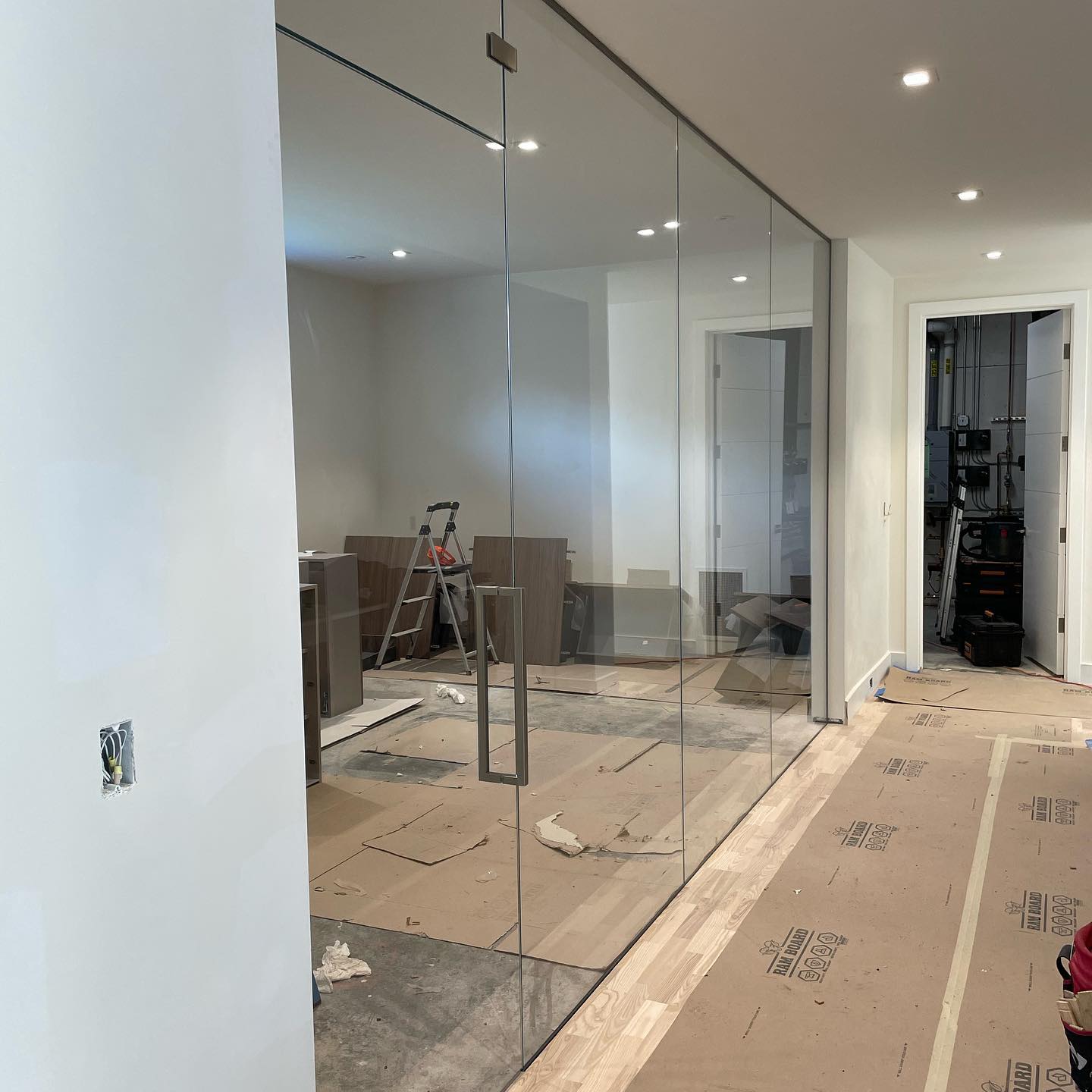 Gym entryway system using 1/2” low iron glass. Brushed nickel hardware. #gym #glass #glassentry